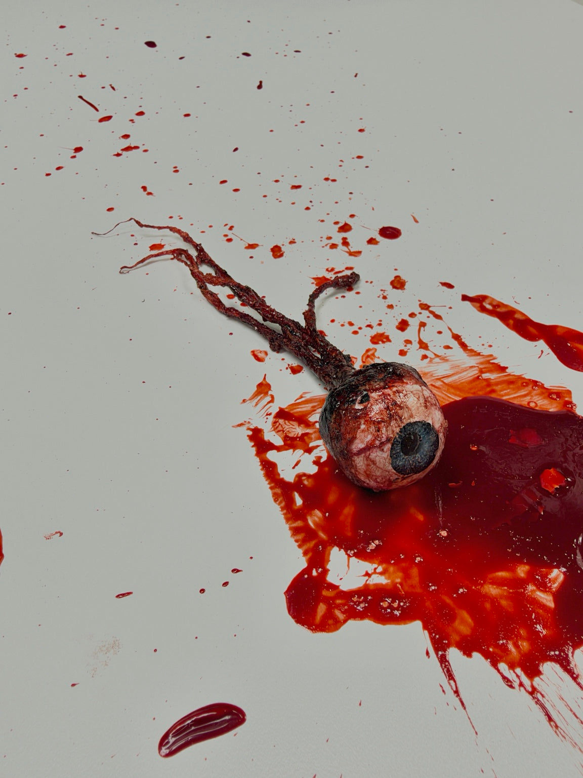 Angled view of the handmade severed eyeball and attached optic nerve